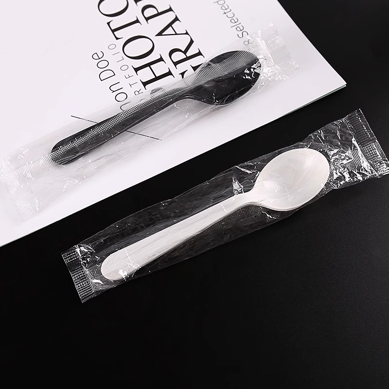 wrapped black plastic spoons (5)